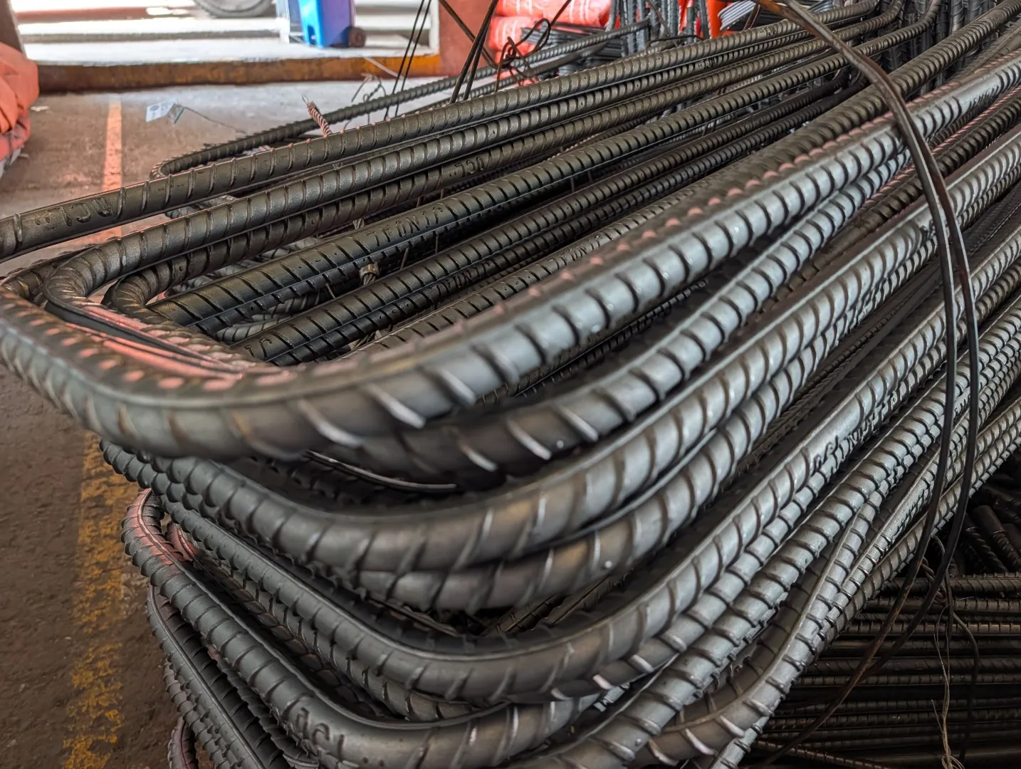 Bundle of bent reinforcement bars with bends and ribs clearly visible
