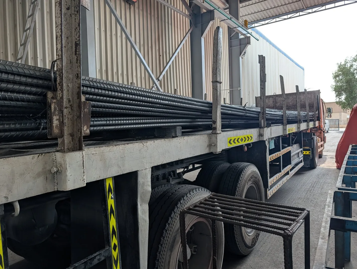 Flatbed truck loaded with reinforcement steel ready for delivery to site